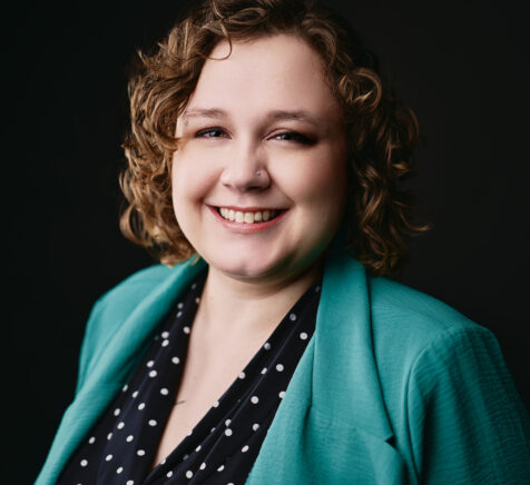 Photo of Omaha Conservatory of Music violin teacher smiling at the camera