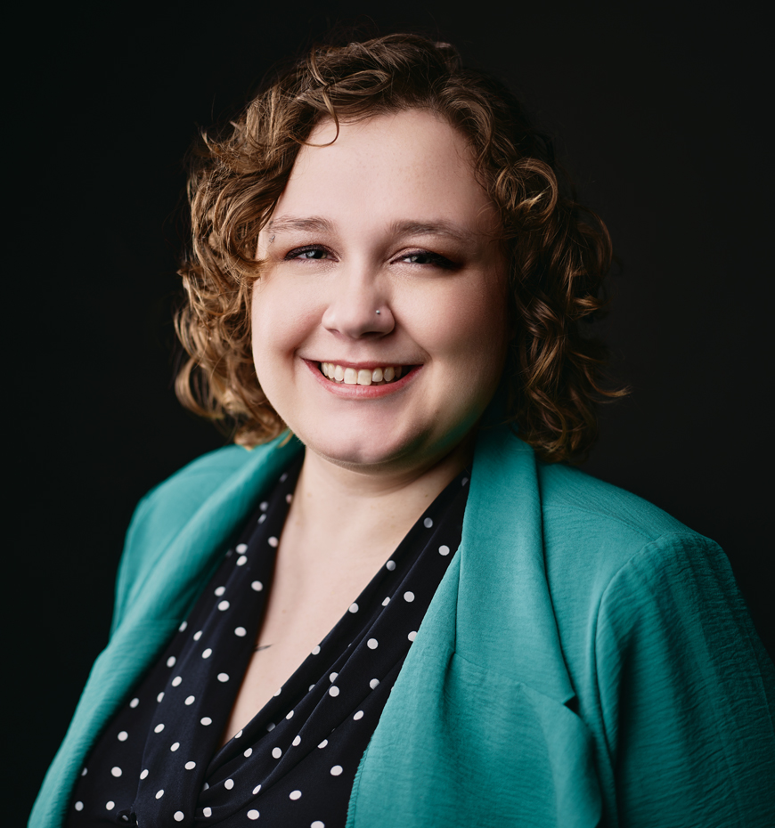 Photo of Omaha Conservatory of Music violin teacher smiling at the camera